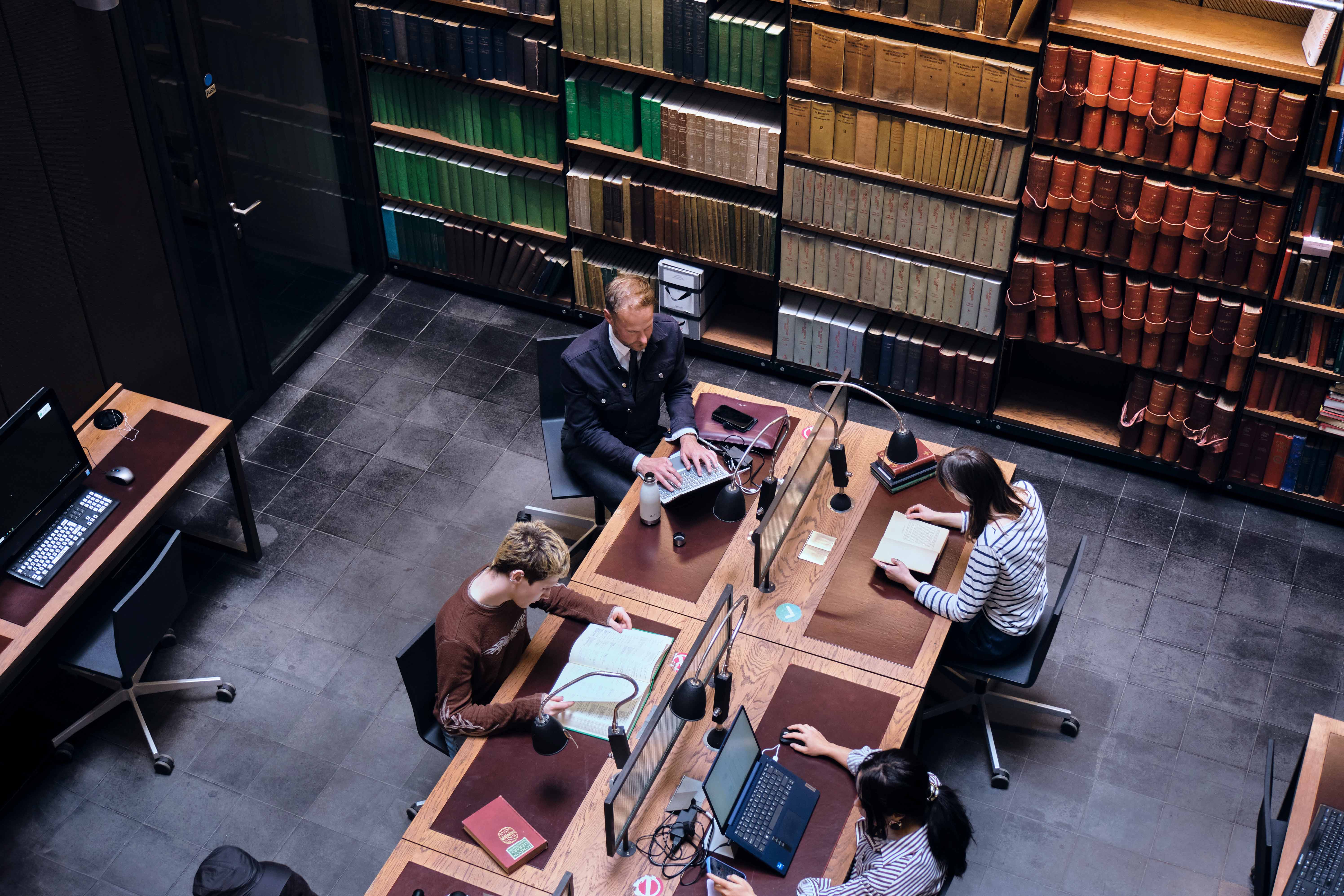 Members at desks in the Foyle Lightwell Reading Room