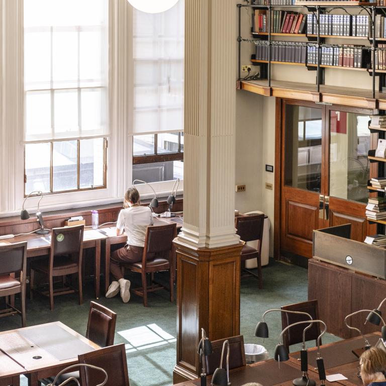 People sat at tables studying in the reading room
