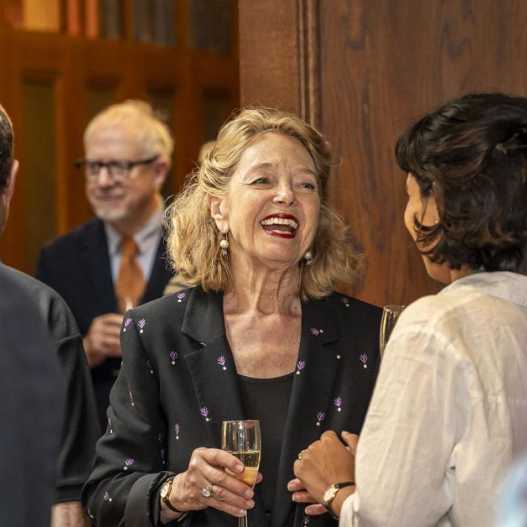two women shaking hands at event in new room at london library