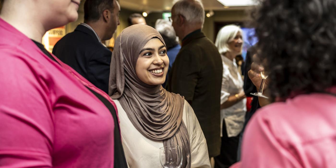 Women talking in a group at an event