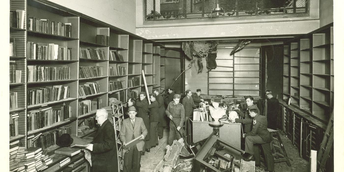 Staff and servicemen clearing wreckage from the Art Room after the 1944 bombing.