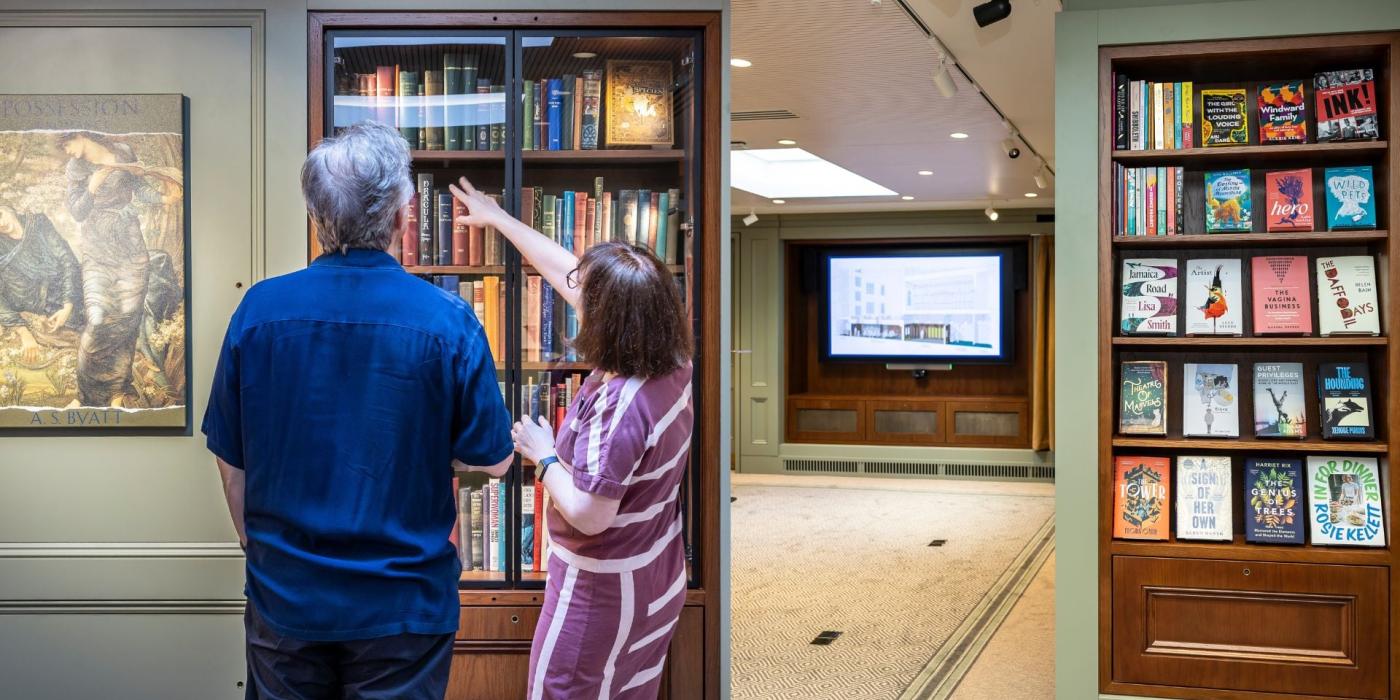 Man and woman looking at a book shelf display
