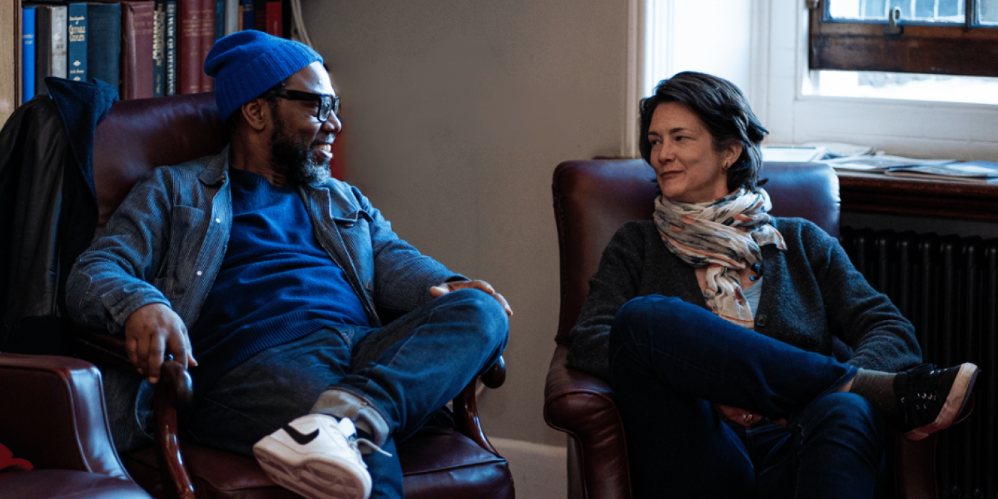 2 people talking on chairs