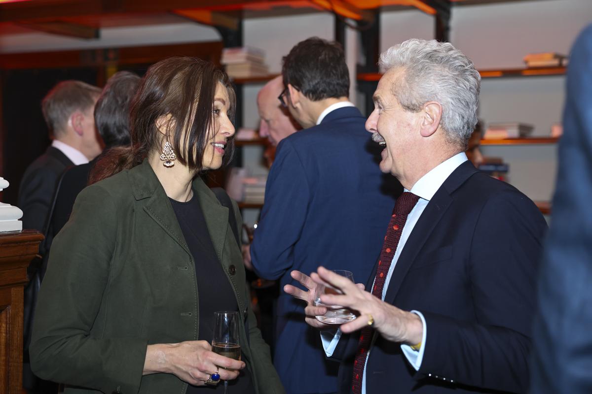 Author Elif Shefak speaking to guest at the Chair's Dinner